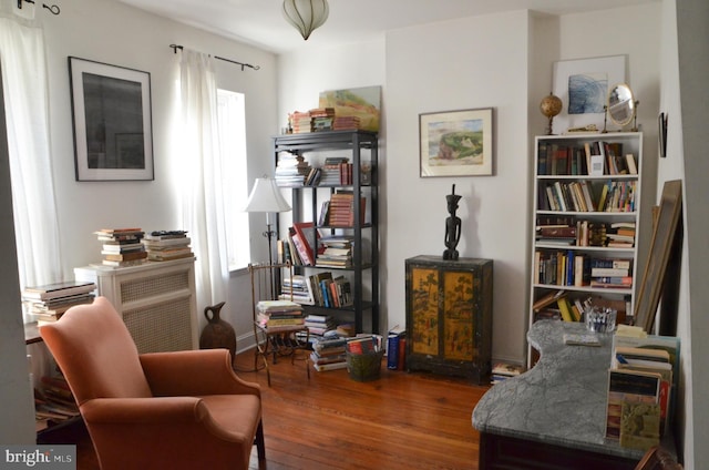 sitting room with hardwood / wood-style floors