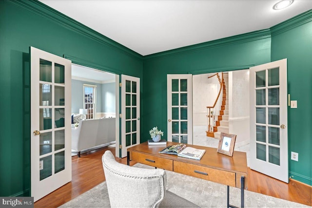 office space with french doors, crown molding, and wood-type flooring