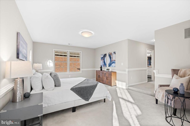 bedroom featuring light colored carpet