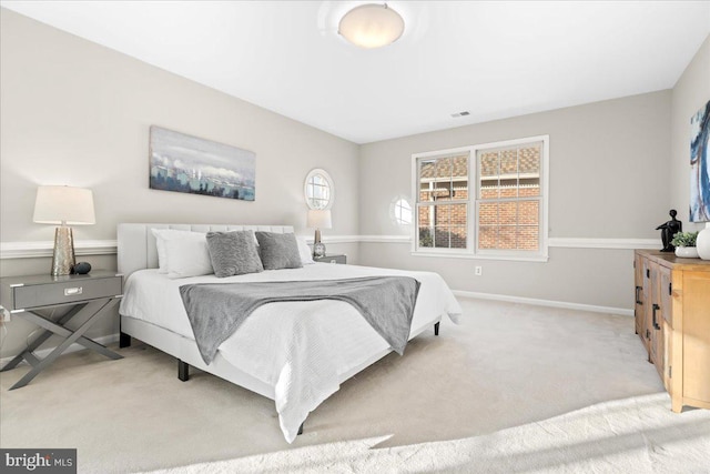 bedroom featuring light colored carpet