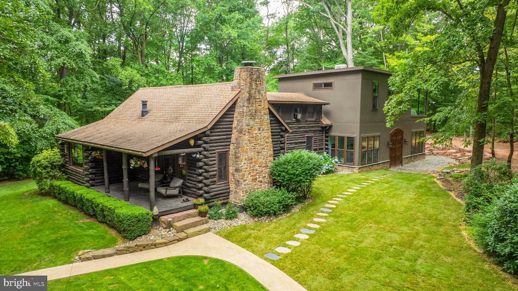 exterior space featuring a yard and a patio area