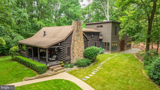 exterior space featuring a yard and a patio area