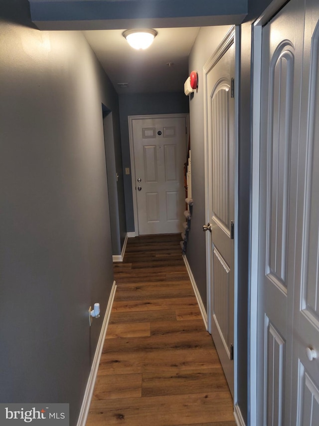 hall with dark hardwood / wood-style floors