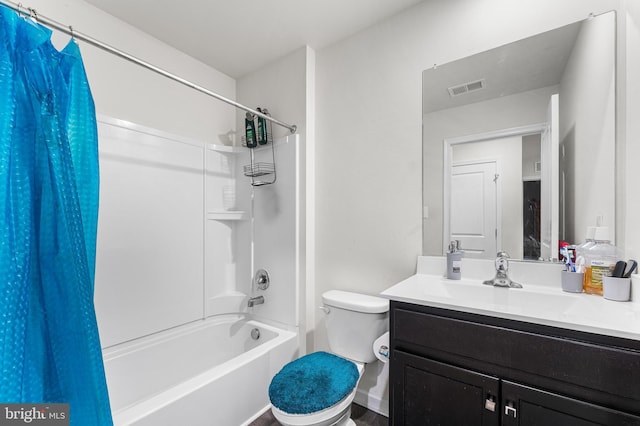 full bathroom featuring shower / bath combo, toilet, and vanity