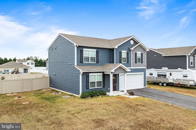 front facade with a front yard and a garage