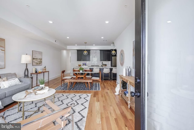 living room with light hardwood / wood-style flooring