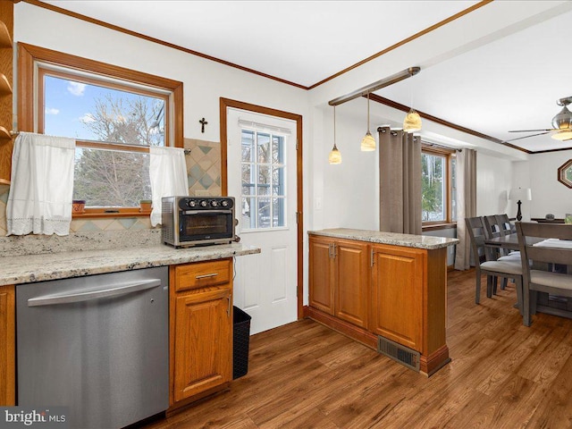 kitchen featuring dishwasher, dark hardwood / wood-style floors, and ornamental molding