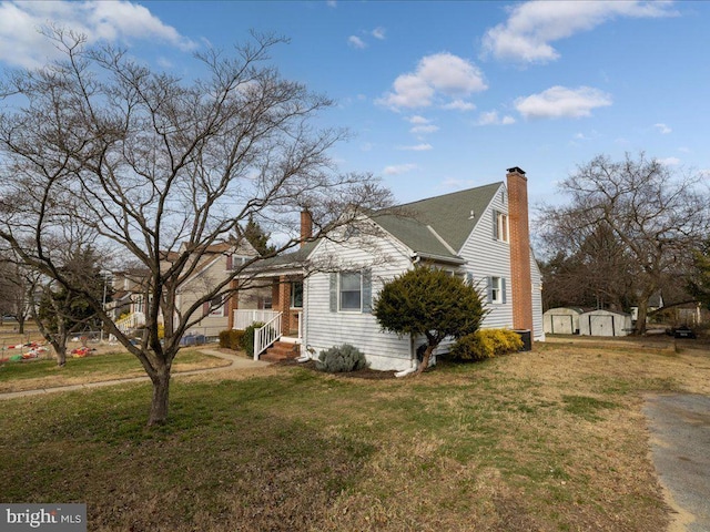 view of side of home featuring a yard