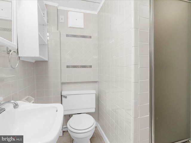 bathroom with sink, tile patterned flooring, toilet, ornamental molding, and an enclosed shower