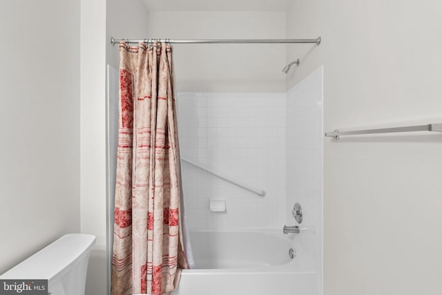 bathroom featuring toilet and shower / bathtub combination with curtain