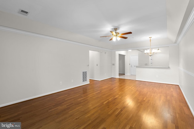 unfurnished living room with baseboards, wood finished floors, visible vents, and ceiling fan with notable chandelier