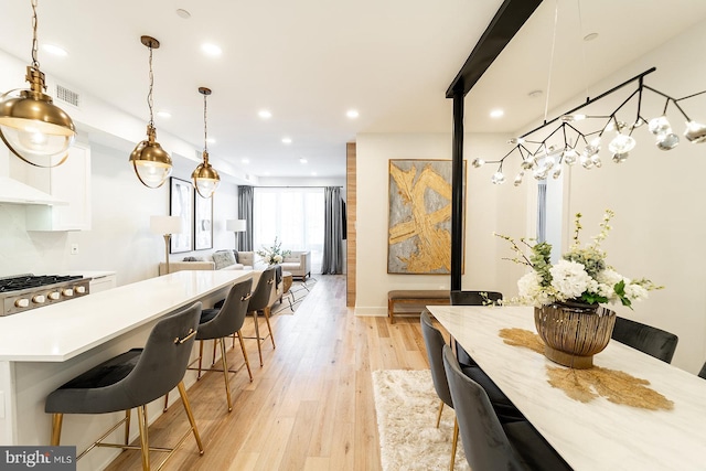 dining room with light wood-type flooring