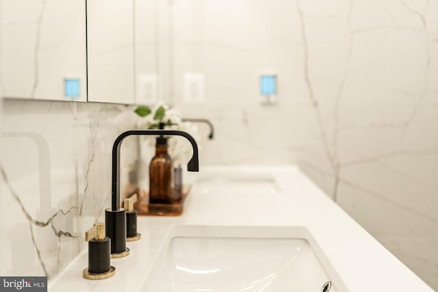 interior details with decorative backsplash and sink