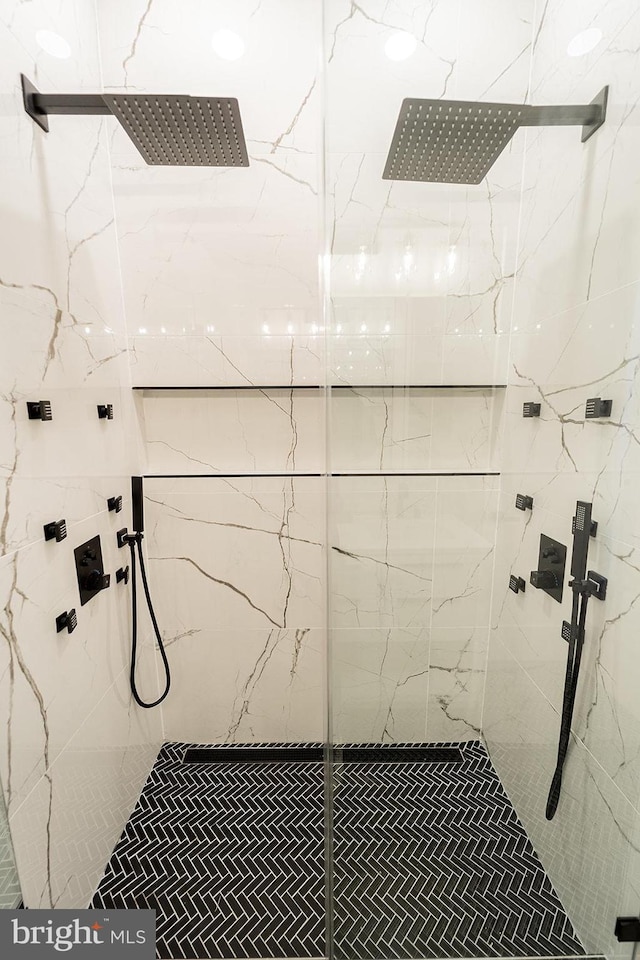 bathroom with tiled shower