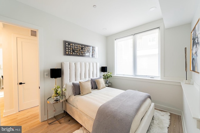 bedroom with light hardwood / wood-style flooring