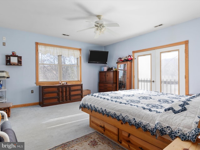 bedroom with ceiling fan, carpet floors, and french doors