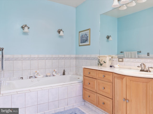 bathroom featuring vanity, tiled bath, and tile patterned floors