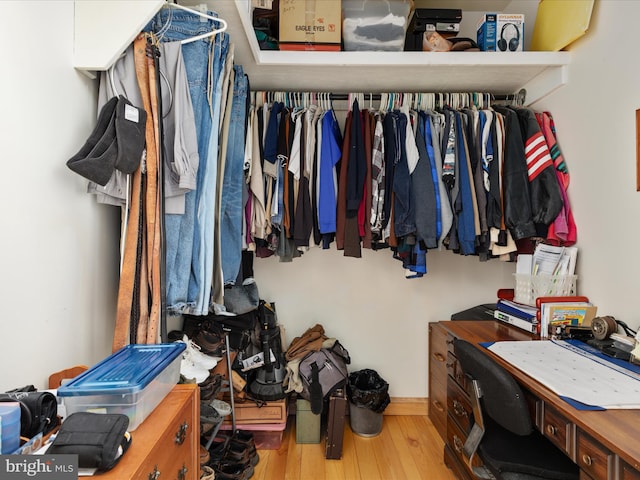 spacious closet with light hardwood / wood-style floors