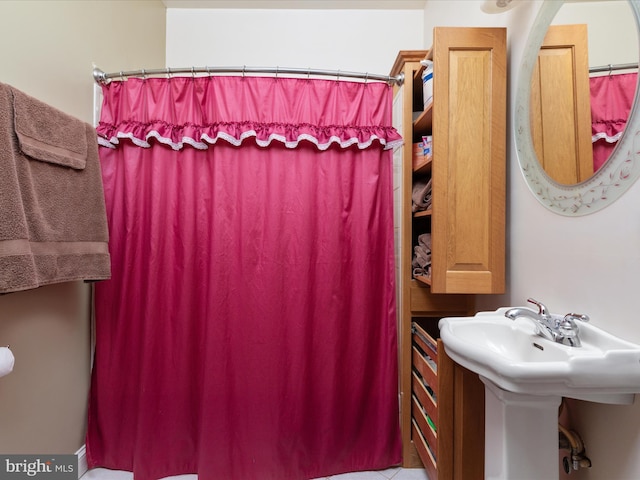 bathroom featuring tile patterned floors and sink