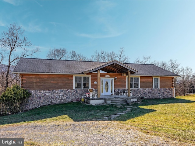 ranch-style house featuring a front yard and a porch