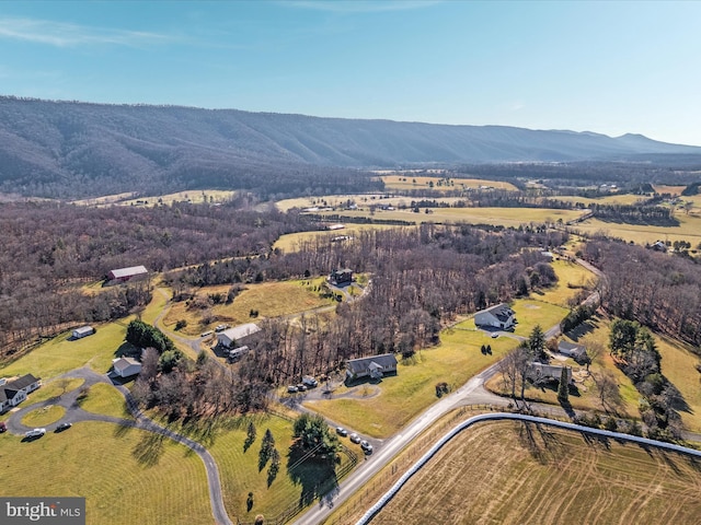 birds eye view of property with a mountain view and a rural view