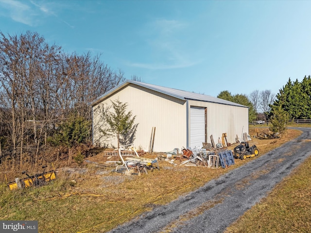 view of outdoor structure with a garage