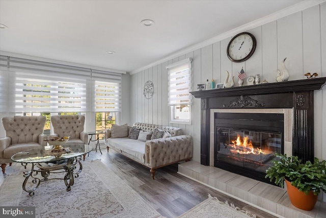 living room with ornamental molding and hardwood / wood-style flooring