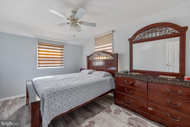 bedroom with hardwood / wood-style floors and ceiling fan