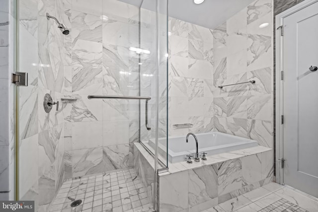 bathroom featuring separate shower and tub