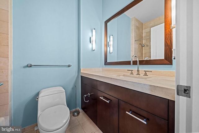 bathroom featuring tile patterned floors, vanity, and toilet