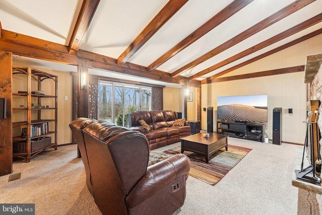 carpeted living room featuring lofted ceiling with beams