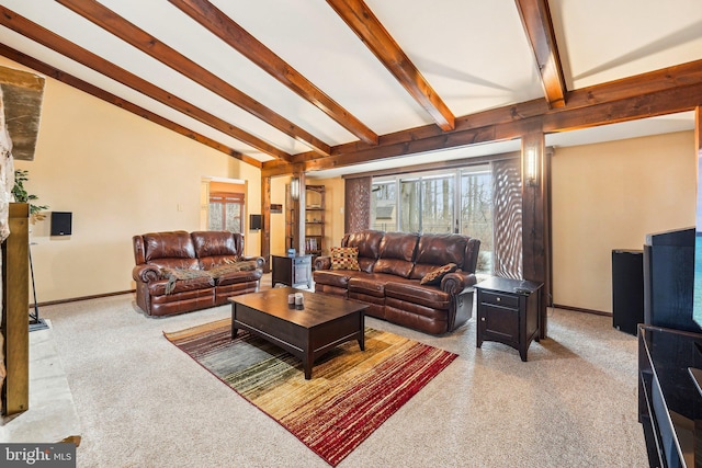 living room with carpet flooring and lofted ceiling with beams