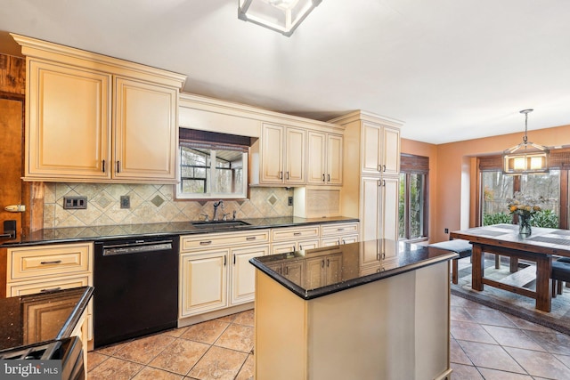 kitchen featuring dishwasher, sink, hanging light fixtures, and cream cabinets