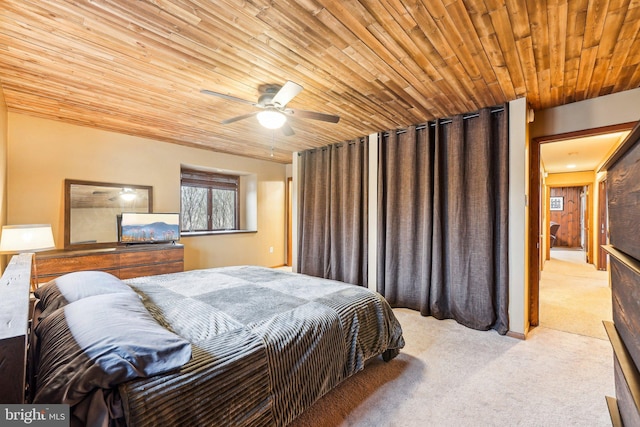 bedroom featuring light carpet, ceiling fan, and wooden ceiling