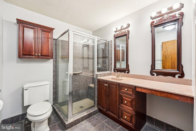 bathroom featuring vanity, toilet, and walk in shower