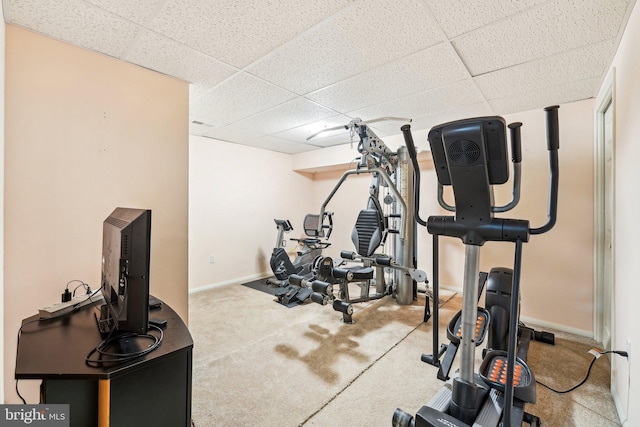 workout room with a paneled ceiling