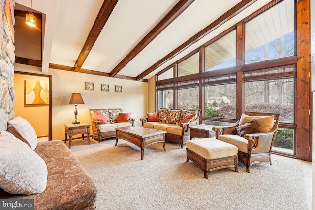 living room featuring high vaulted ceiling, beam ceiling, carpet floors, and a wealth of natural light