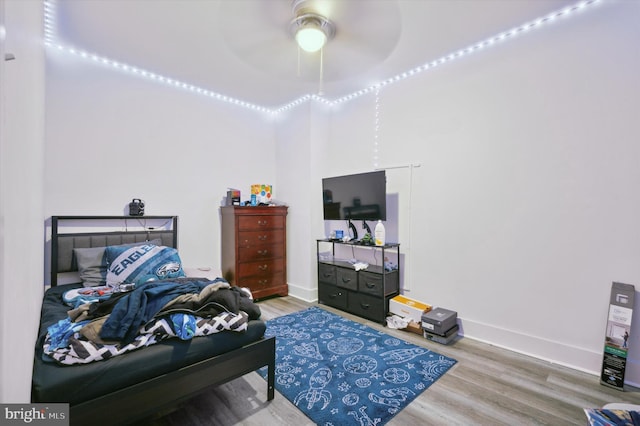 bedroom with ceiling fan and wood-type flooring