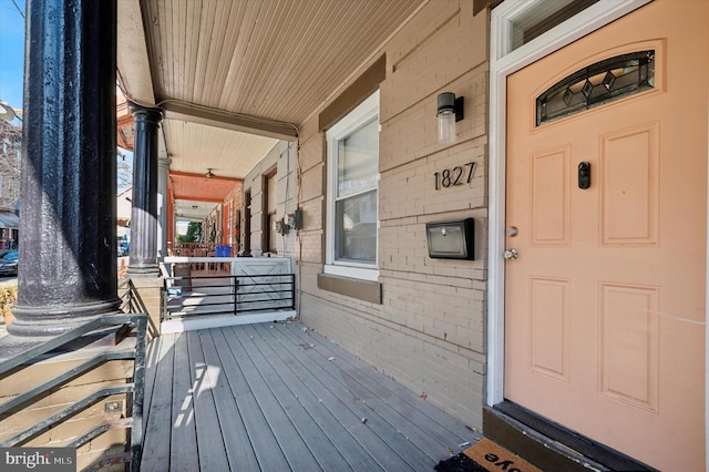 wooden terrace featuring a porch