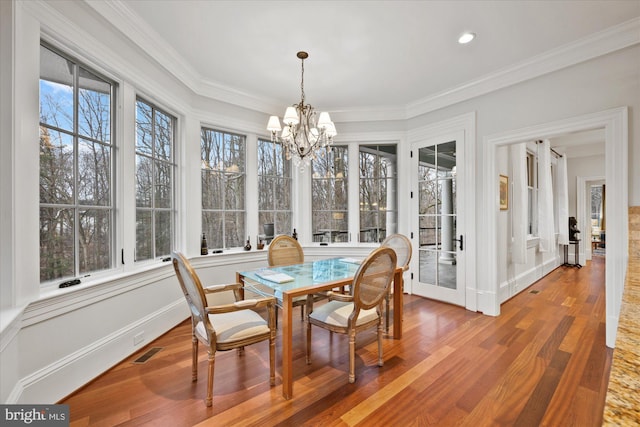 sunroom with an inviting chandelier