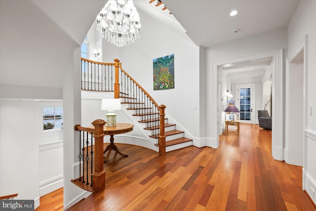 entryway featuring an inviting chandelier and hardwood / wood-style floors