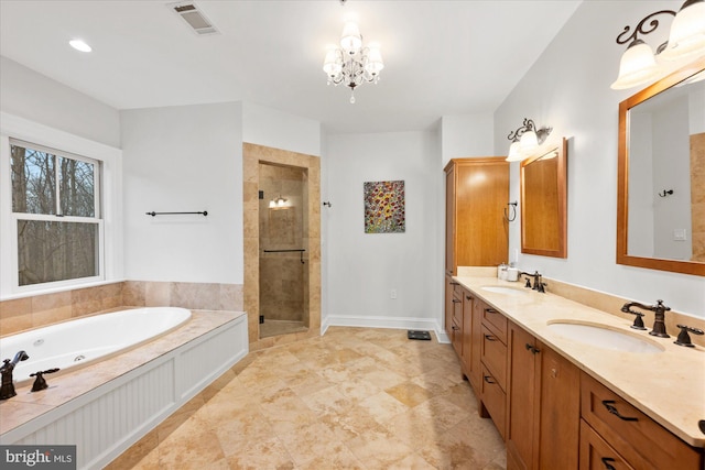 bathroom featuring vanity, a notable chandelier, and separate shower and tub