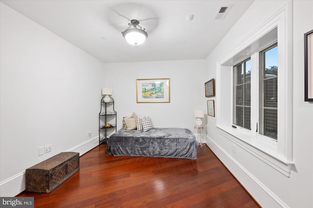 bedroom with hardwood / wood-style floors