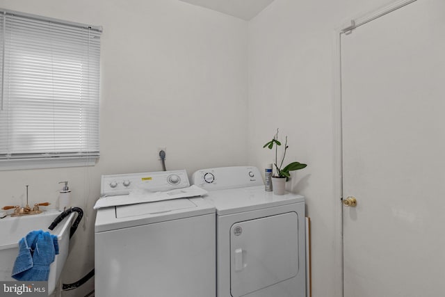 laundry area with washing machine and clothes dryer