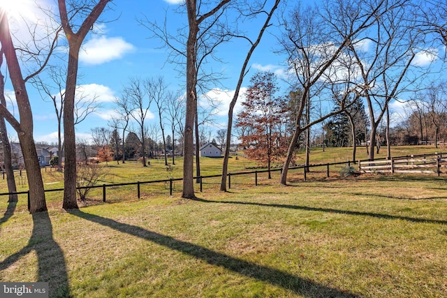 view of yard with a rural view