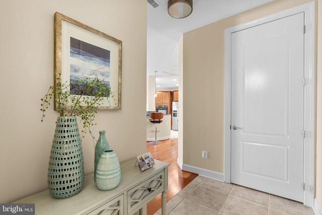 foyer entrance with light hardwood / wood-style flooring