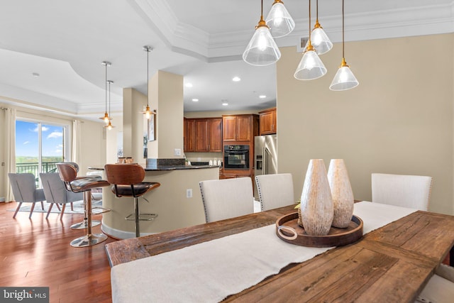 1915 Towne Centre Blvd Unit 502, Annapolis, MD 21401 - dining room with crown molding, a tray ceiling, dark wood-style floors, and recessed lighting