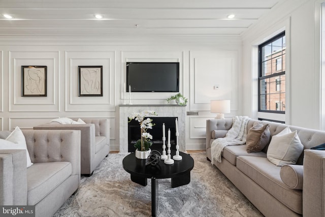 living room featuring crown molding