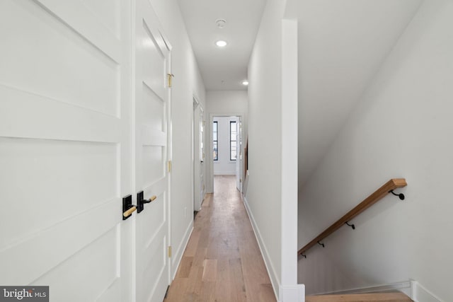 hall with light hardwood / wood-style floors