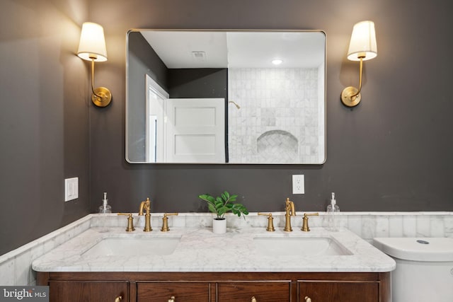 bathroom with vanity and toilet